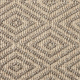 Close-up of a textured natural fibre woven diamond pattern rug in taupe. 