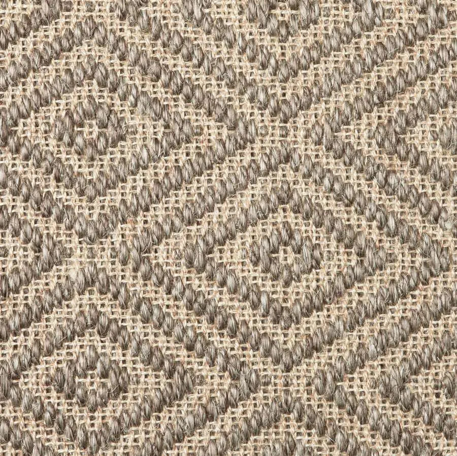 Close-up of a textured natural fibre woven diamond pattern rug in taupe. 