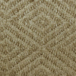 Close-up of a textured natural fibre woven diamond pattern rug in tan. 
