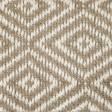 Close-up of a textured natural fibre woven diamond pattern rug in beige. 