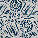 Close-up of fabric in a dense floral print in navy on a white field.