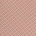 Detail of woven fabric in a geometric grid print in red and navy on a cream field.