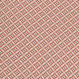 Detail of woven fabric in a geometric grid print in red and navy on a cream field.