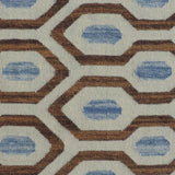 Close-up of a patterned rug with blue and brown geometric design