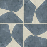 Detail of wallpaper in a geometric grid print in blue-gray on a mottled cream field.