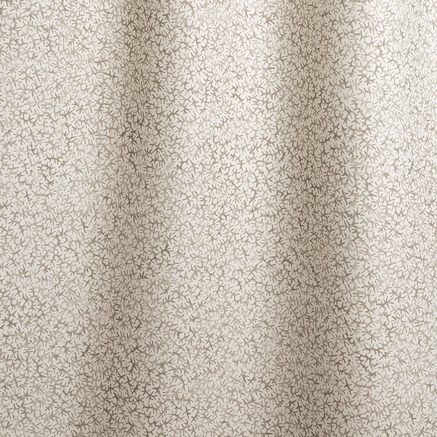Draped fabric with small scale coral design in grey on white. 
