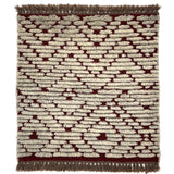 Handknotted Moroccan style rug with a raised ivory cut pile motif. 
