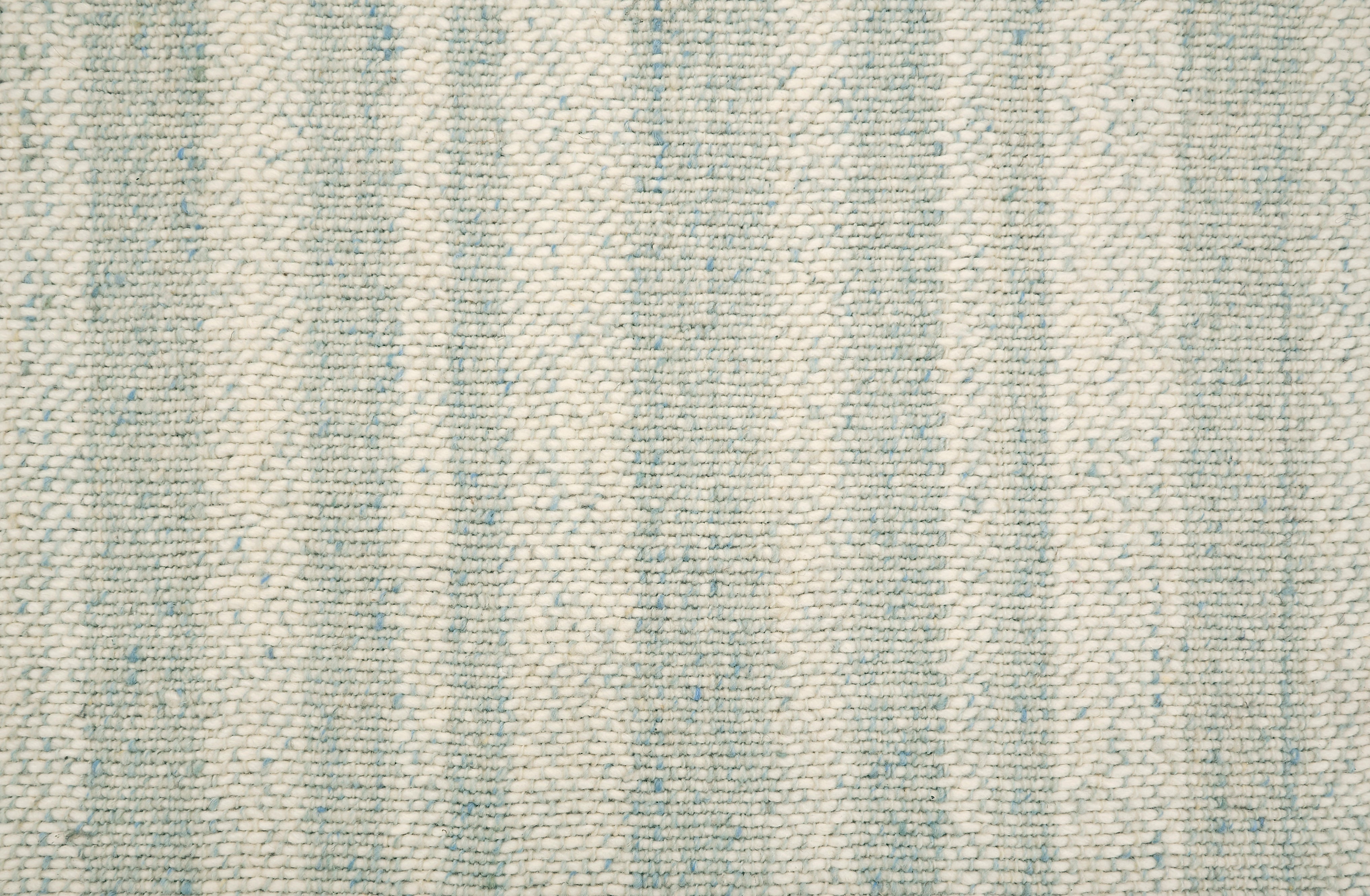 Textural striped broadloom carpet in light blue and cream.