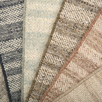 Close-up of various textured rug samples.