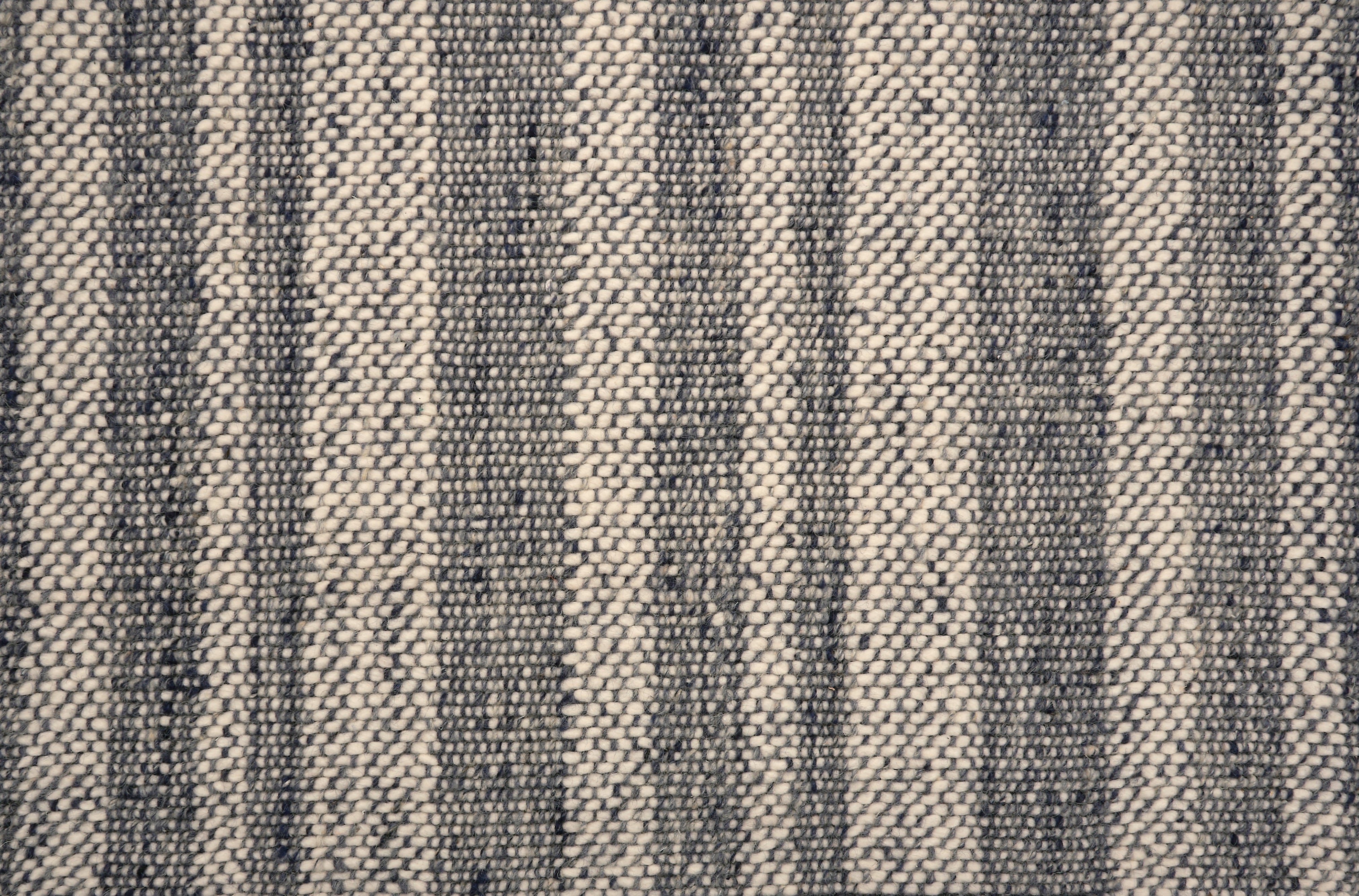 Textural striped broadloom carpet in dark blue and cream