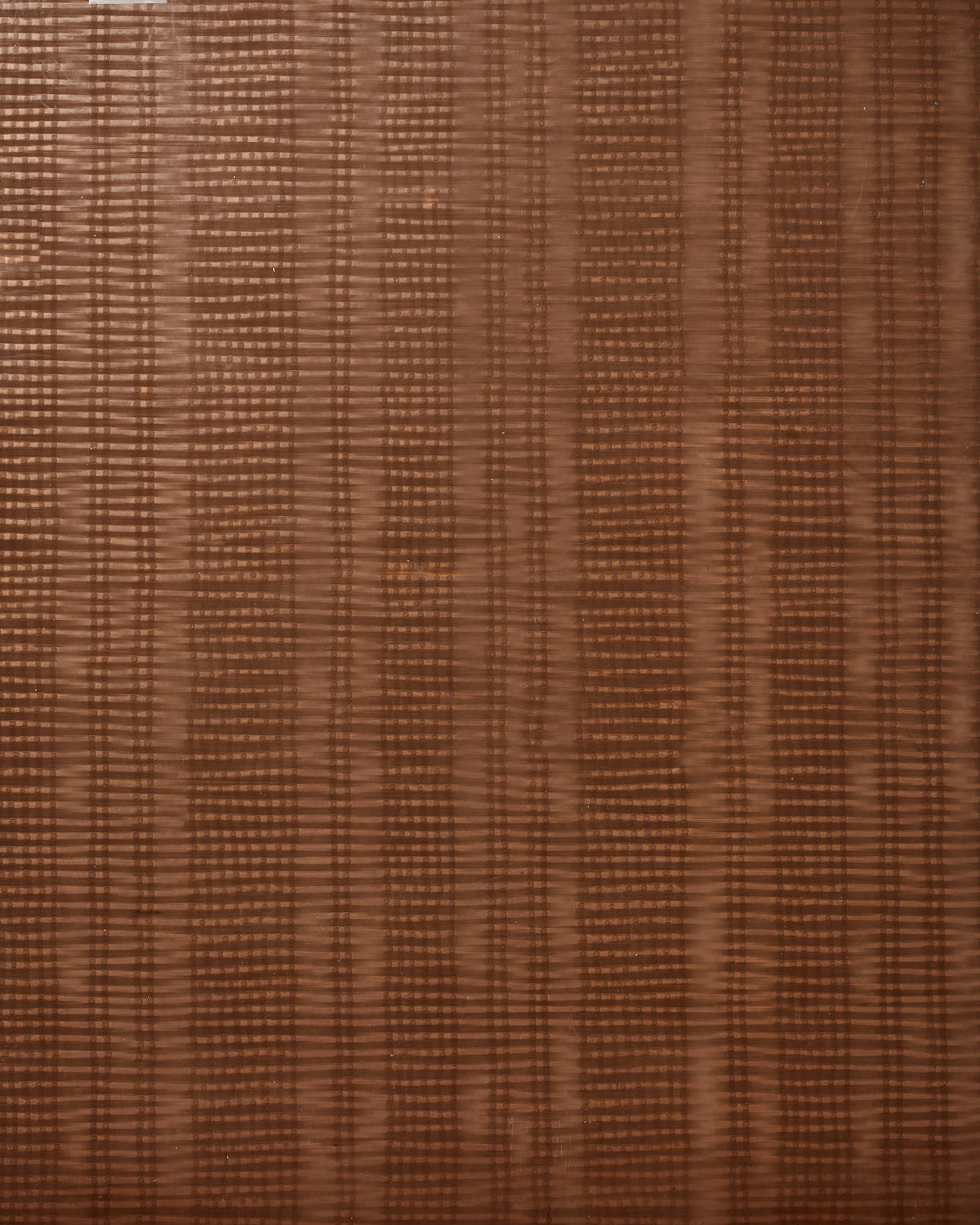 Detail of wallpaper in a textural stripe print in shades of brown.