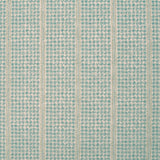 Detail of fabric in a dense repeating stripe and star print in turquoise on a tan field.