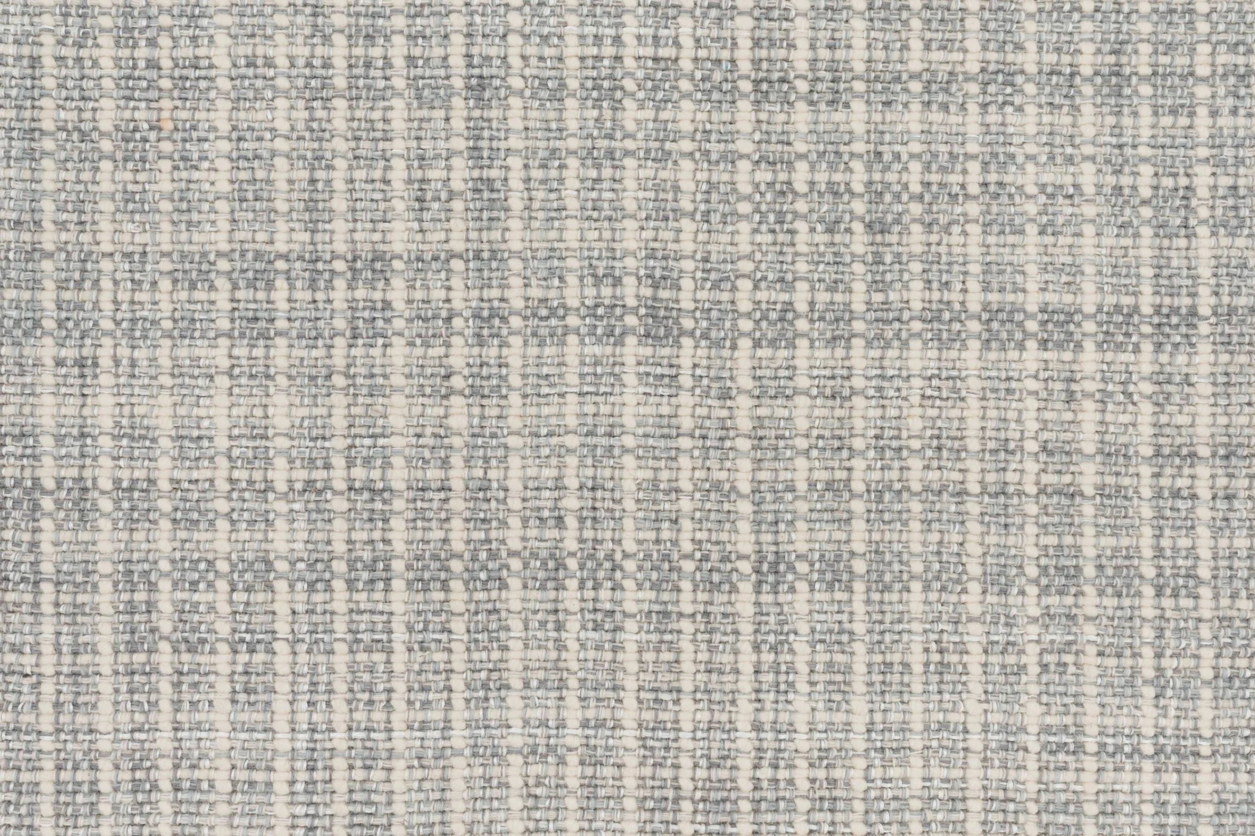 Textural basketweave broadloom in light grey.