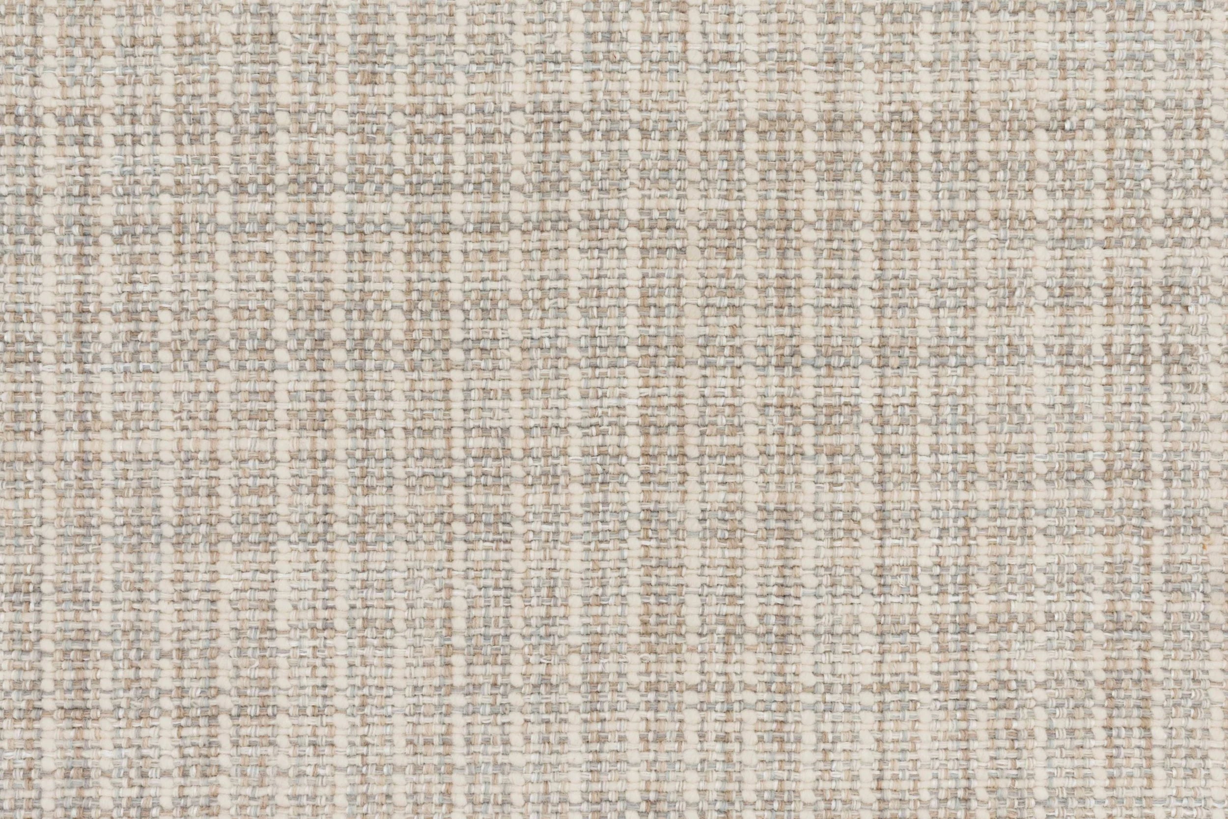 Textural basketweave broadloom in ecru.