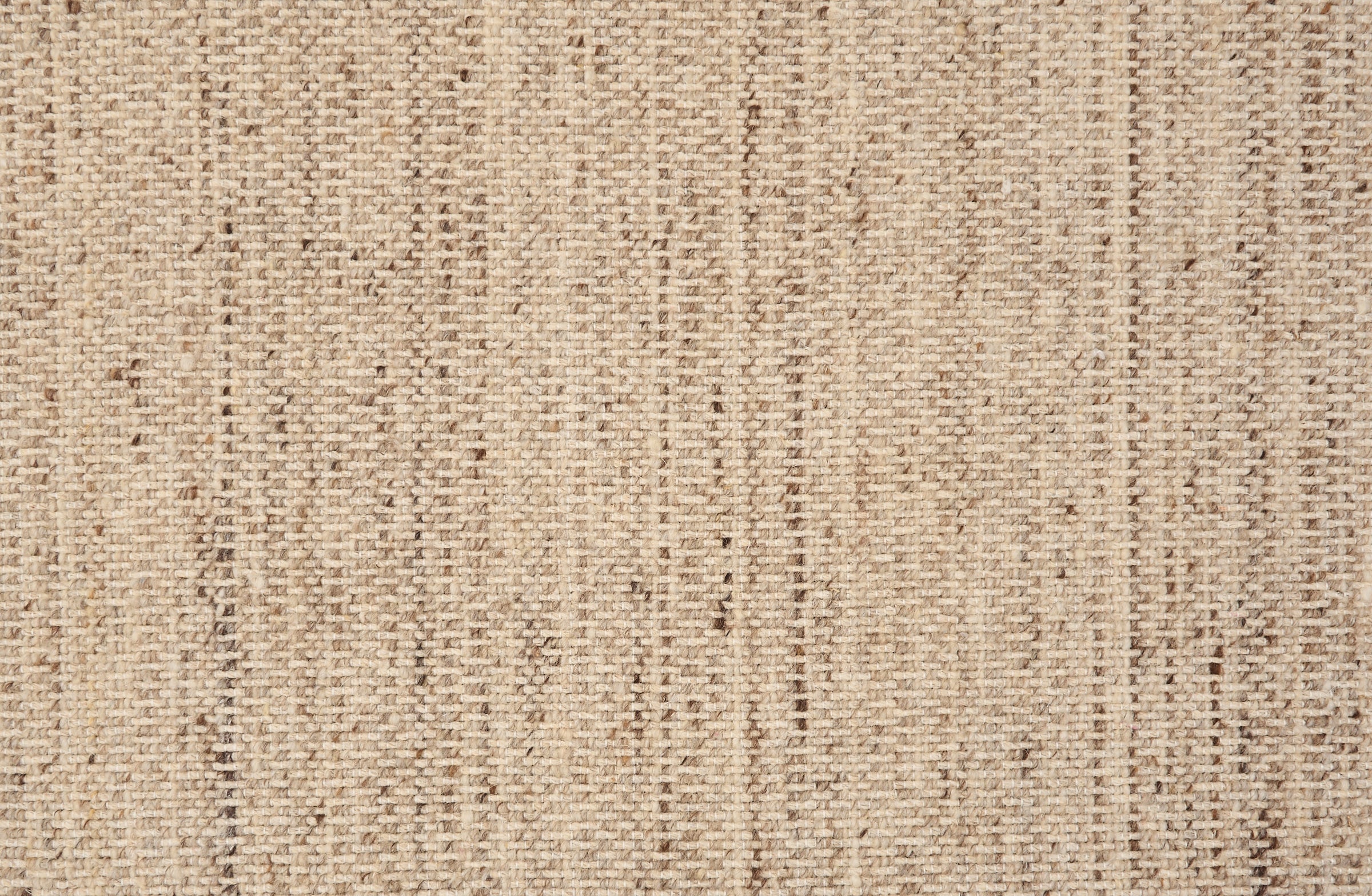 Textural strié broadloom in shades of light brown.