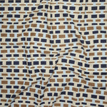 Close up of printed linen with graphic plaid pattern in shades of brown, tan, light and navy blue