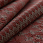 Close-up of red fabric with geometric patterns