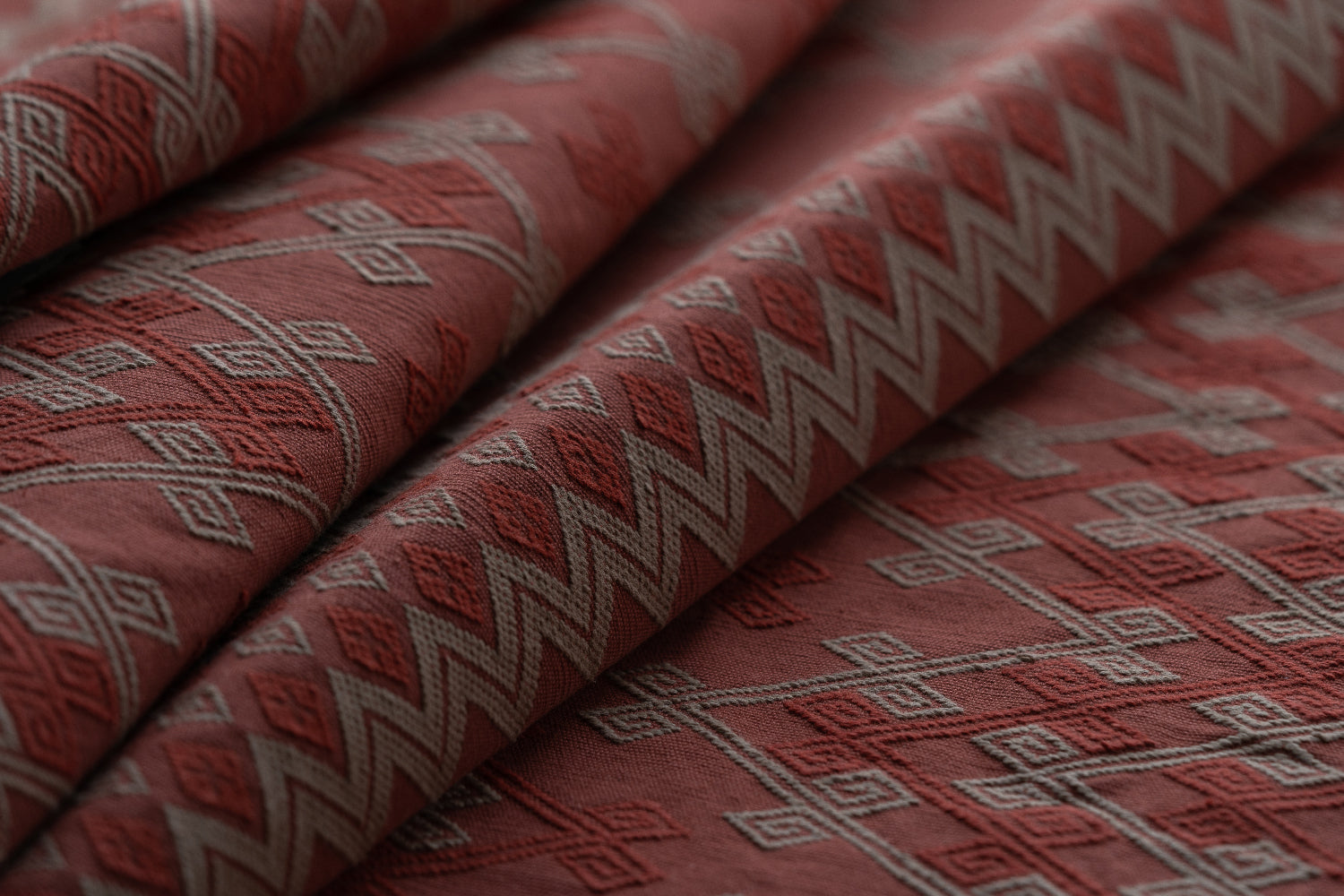Close-up of red fabric with geometric patterns