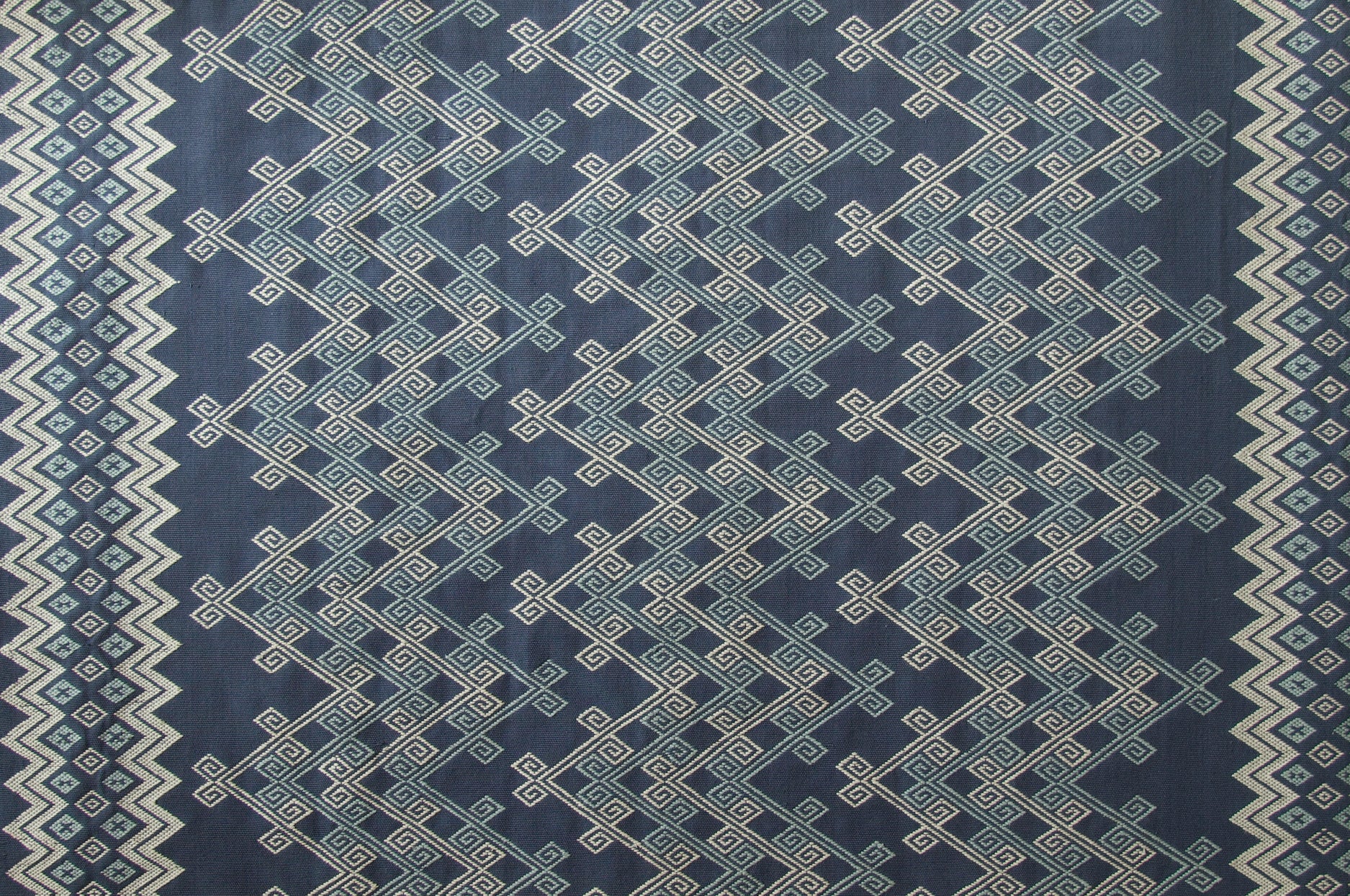 Textile with geometric pattern on a blue background
