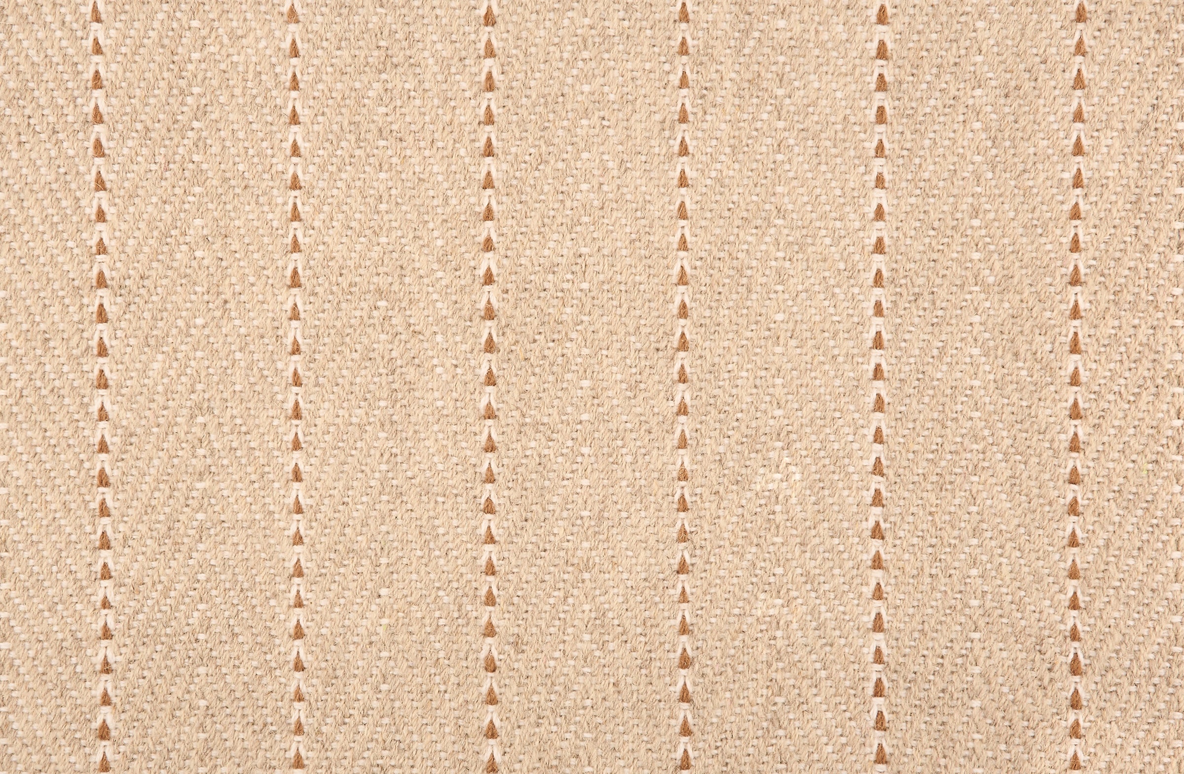 Broadloom carpet in a herringbone pattern in beige with a rust brown stripe accent.