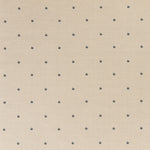 Printed linen fabric in a repeating small-scale flower pattern in navy on a cream field.