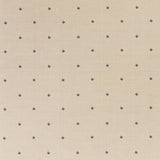 Printed linen fabric in a repeating small-scale flower pattern in navy on a cream field.
