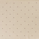 Printed linen fabric in a repeating small-scale flower pattern in red and gray on a cream field.