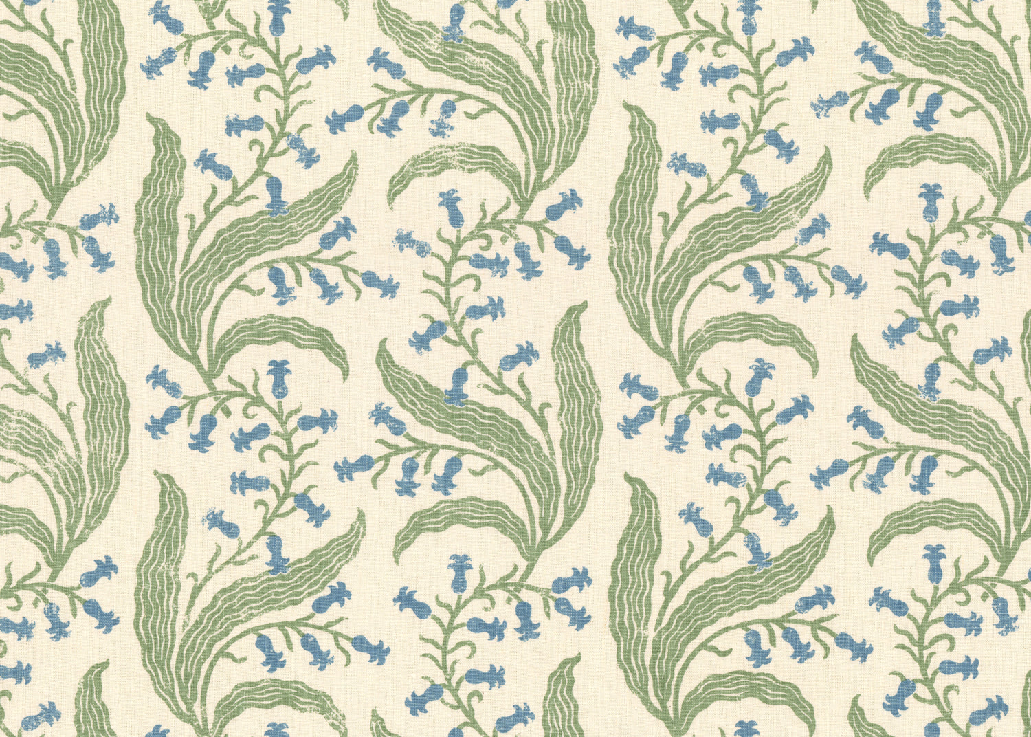 Printed linen in a scrolling floral pattern in blue and green on a cream field. 