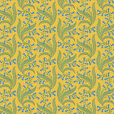 Wallpaper in a scrolling floral pattern in blue and green on a yellow field. 