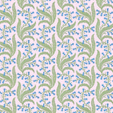 Wallpaper in a scrolling floral pattern in blue and green on a pink field. 
