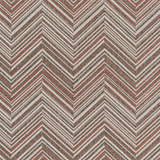 Broadloom carpet in a bold chevron pattern in shades of white, brown and rust orange.