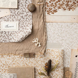 Moodboard image with layered swatches of coral pattern in warm neutral tones and natural specimens. 