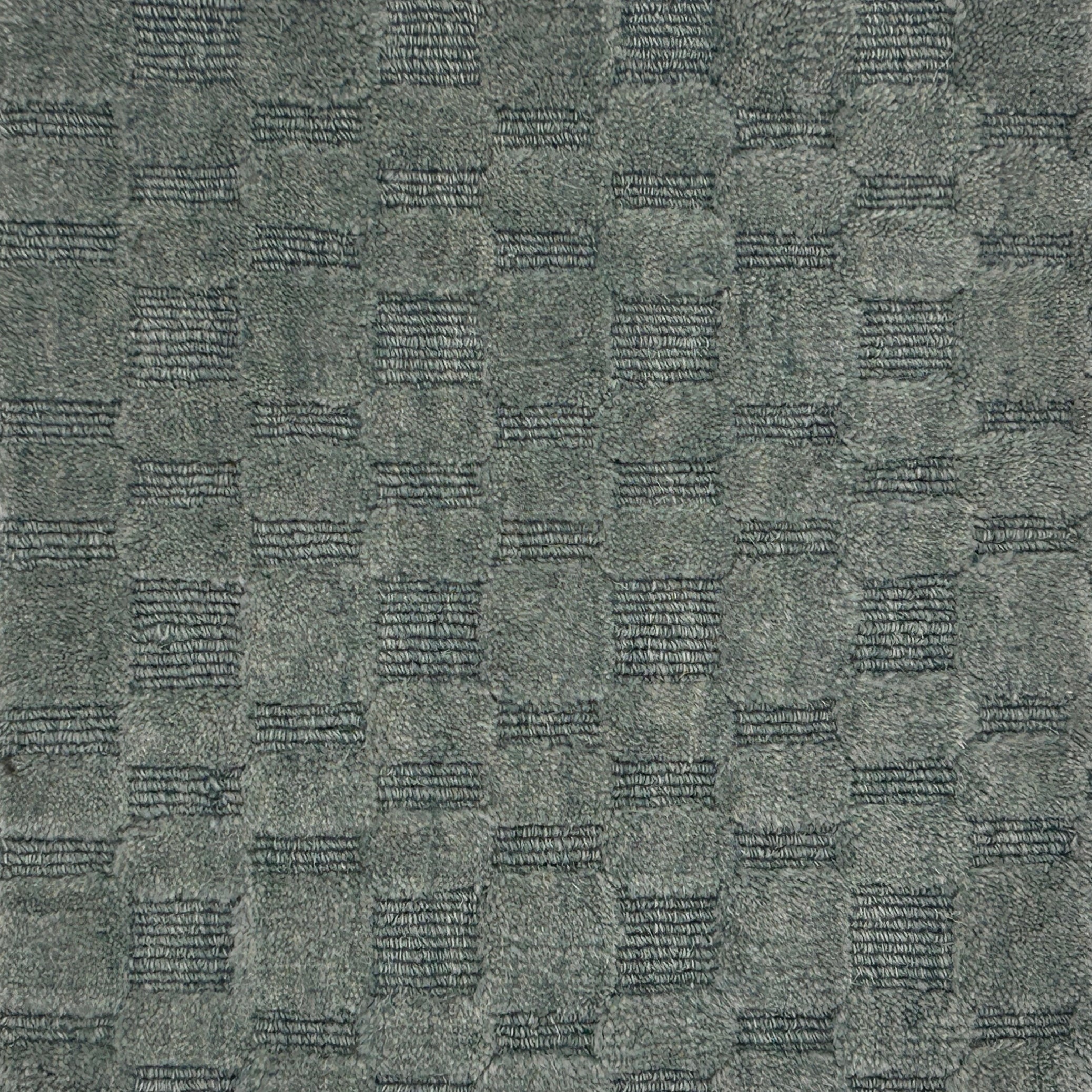 Textured slate blue carpet with a checkered pattern
