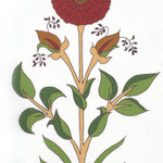 Detail of fabric in a large-scale marigold print in red, green and orange on a white field.