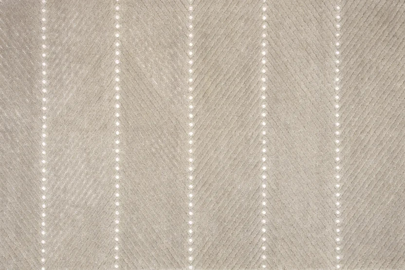 Broadloom carpet swatch in a textured pattern in a grey design