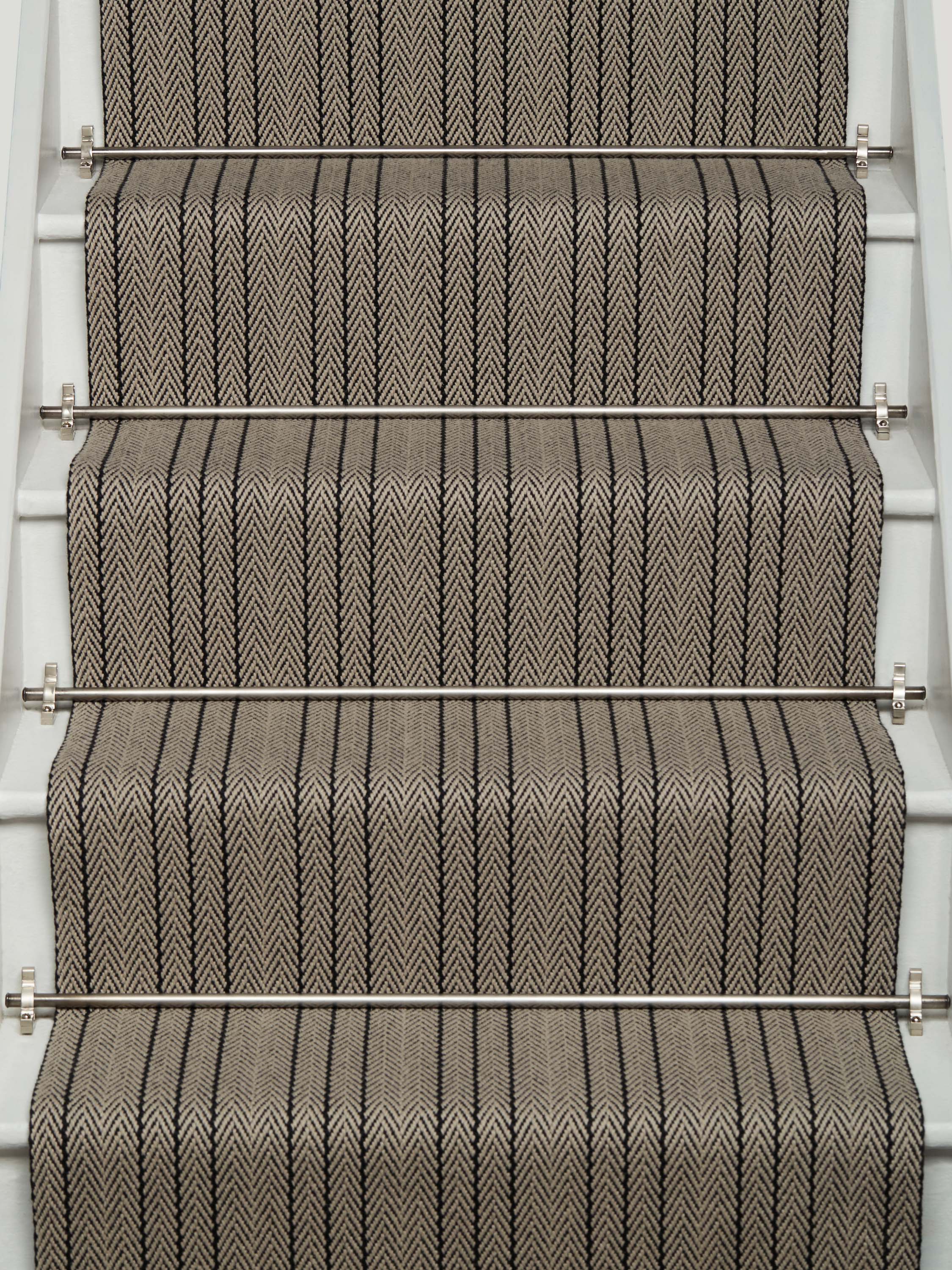 Striped flatweave runner in black and ivory on white staircase