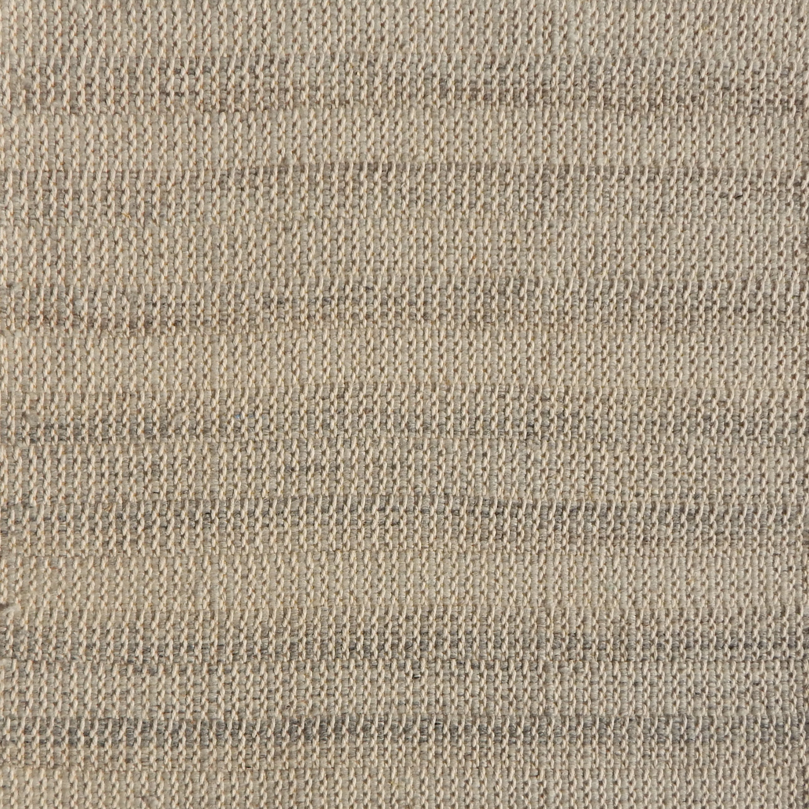 Flatweave rug in a textural stripe in shades of oatmeal