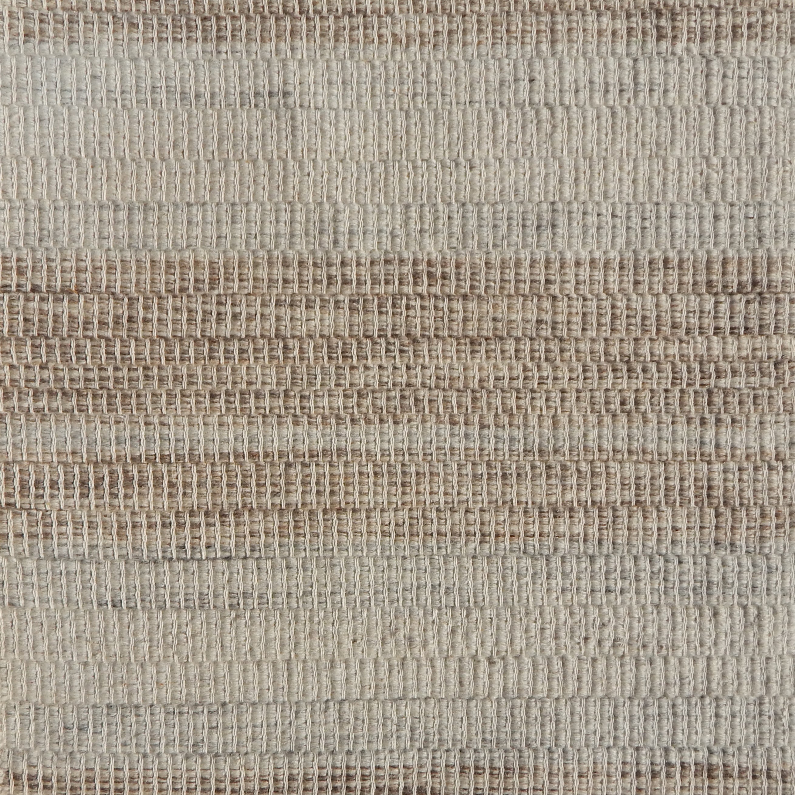 Flatweave rug in a subtle stripe in brown and grey.