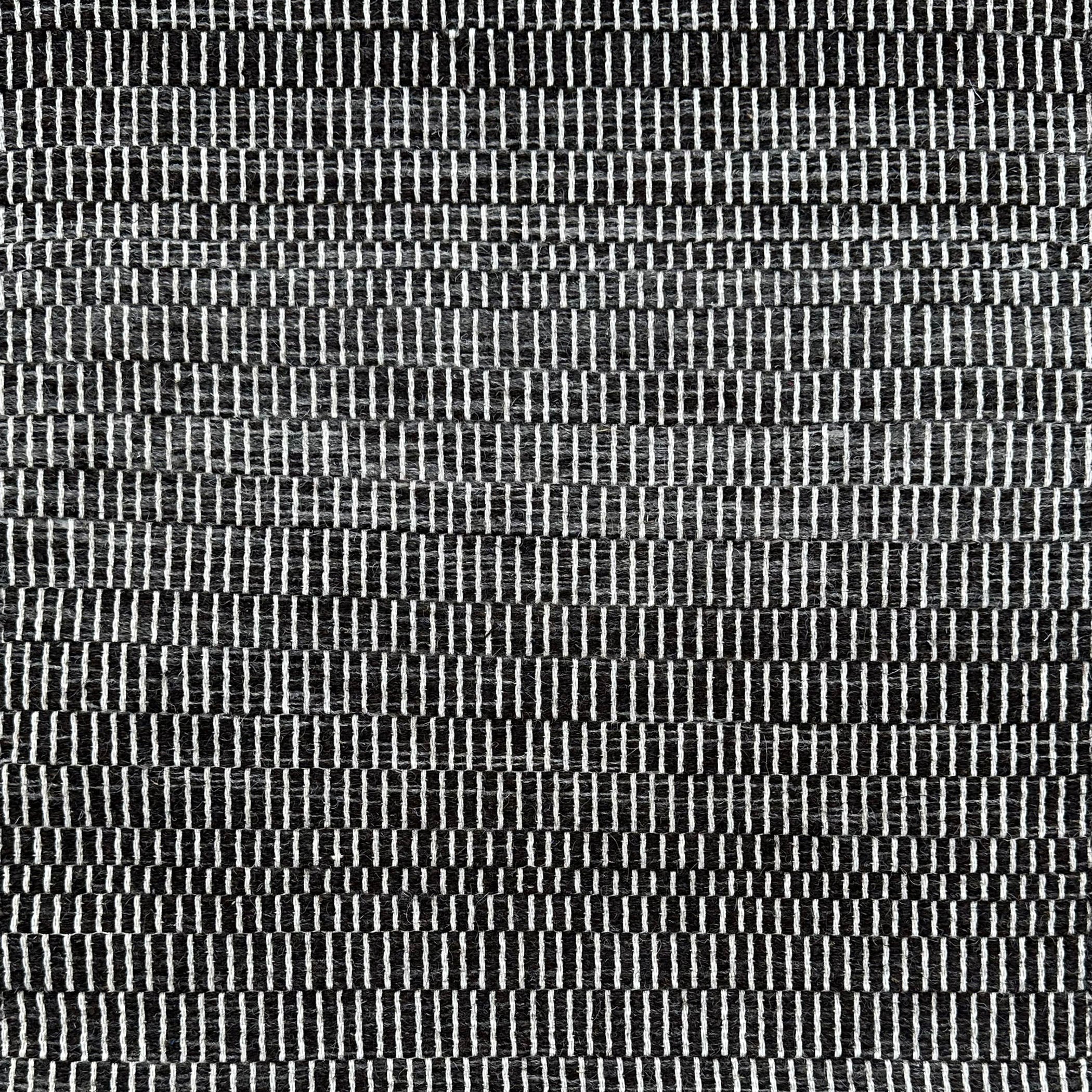 Flatweave rug in a subtle stripe in black and white. 