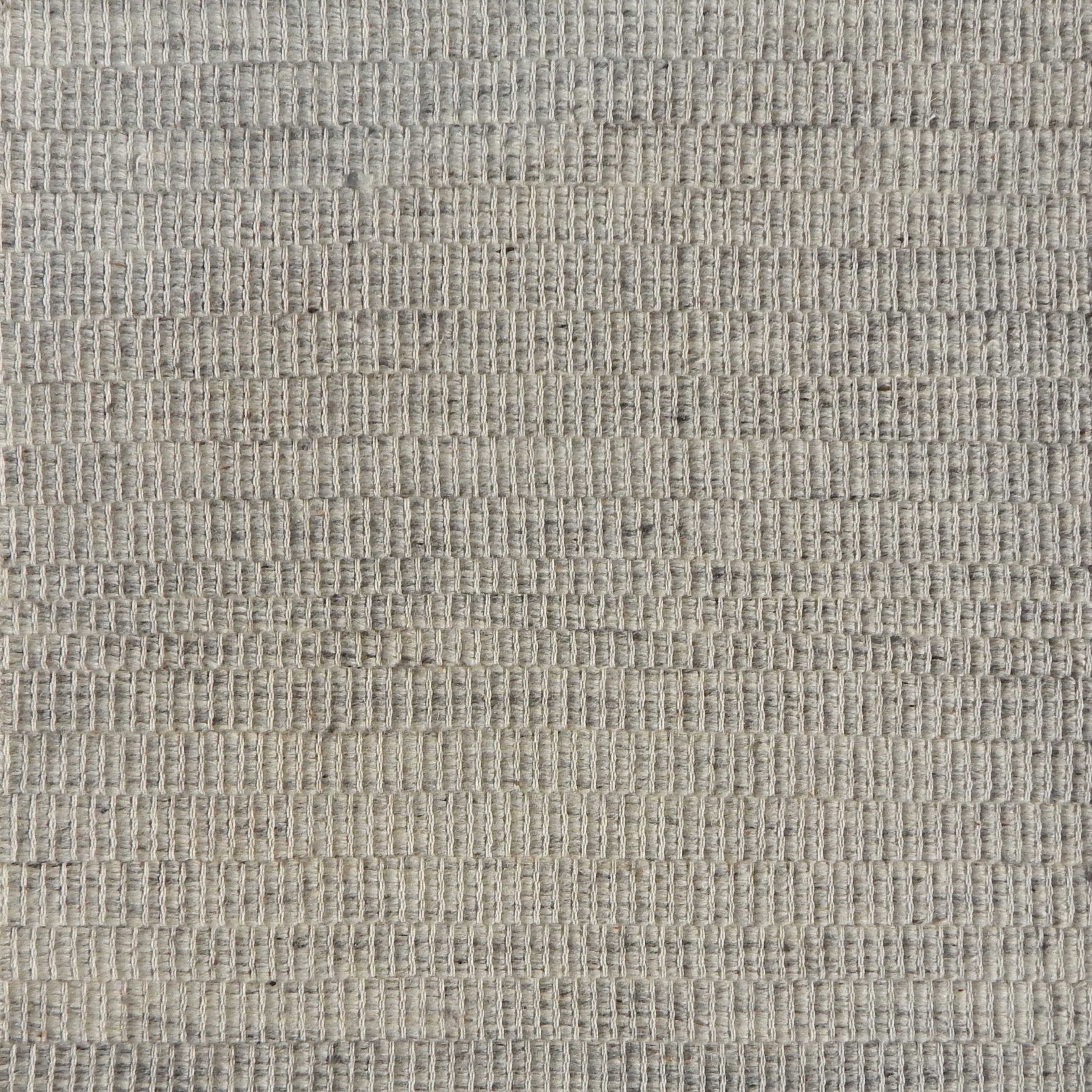 Flatweave rug in a textural grey.