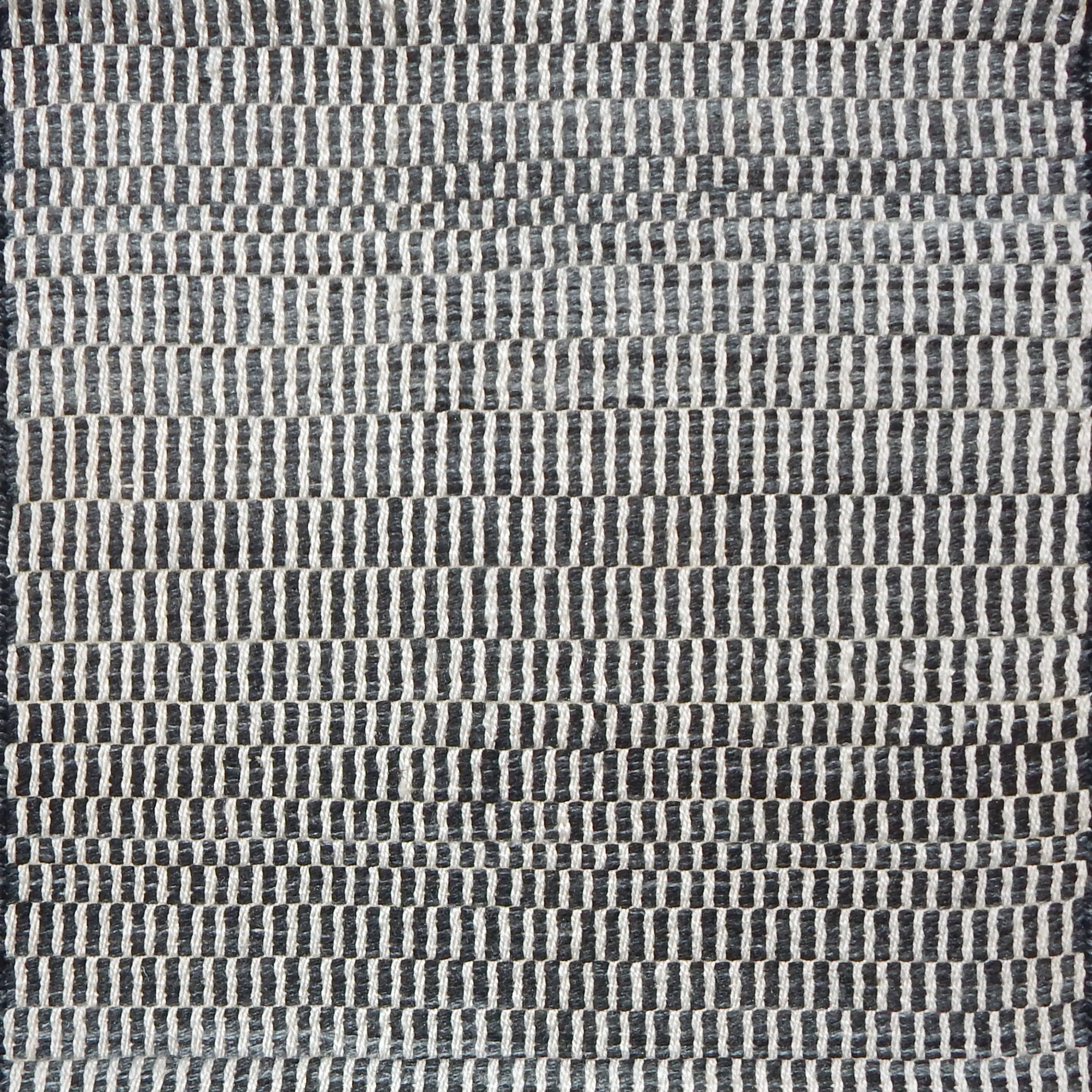 Textural woven carpet in charcoal