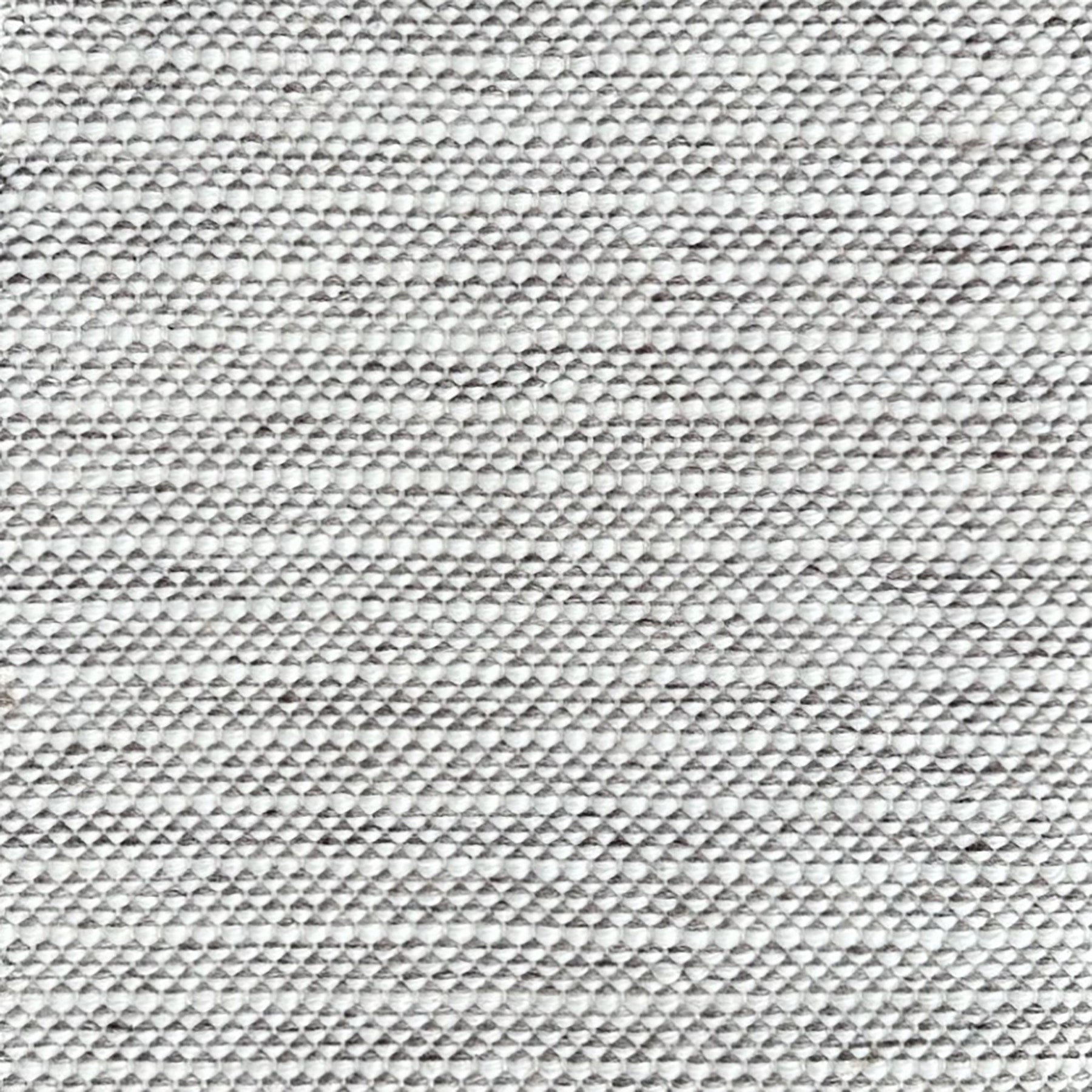 Grey and white striped woven rug. 