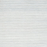 Close-up of a textured light gray woven rug