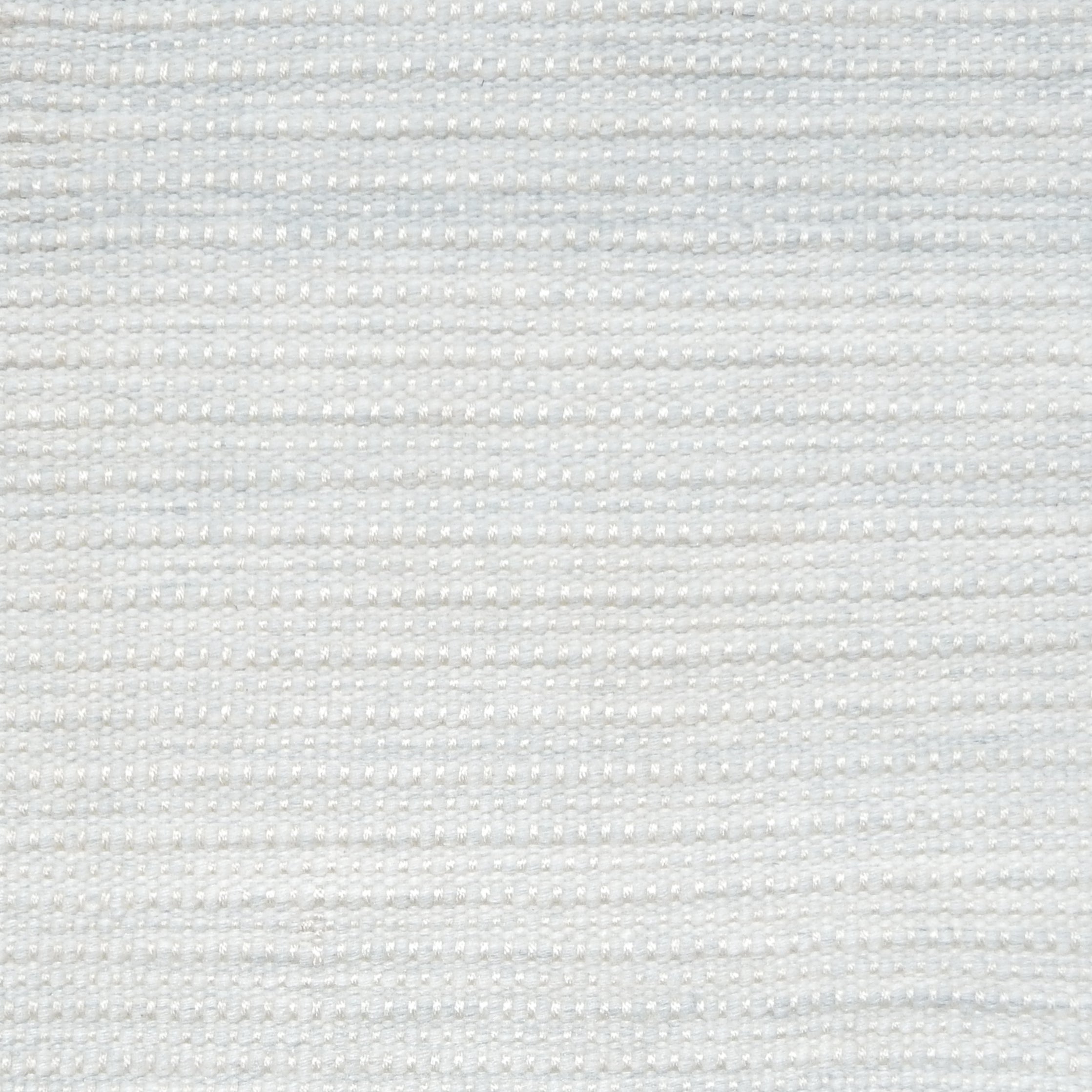 Close-up of a textured light gray woven rug