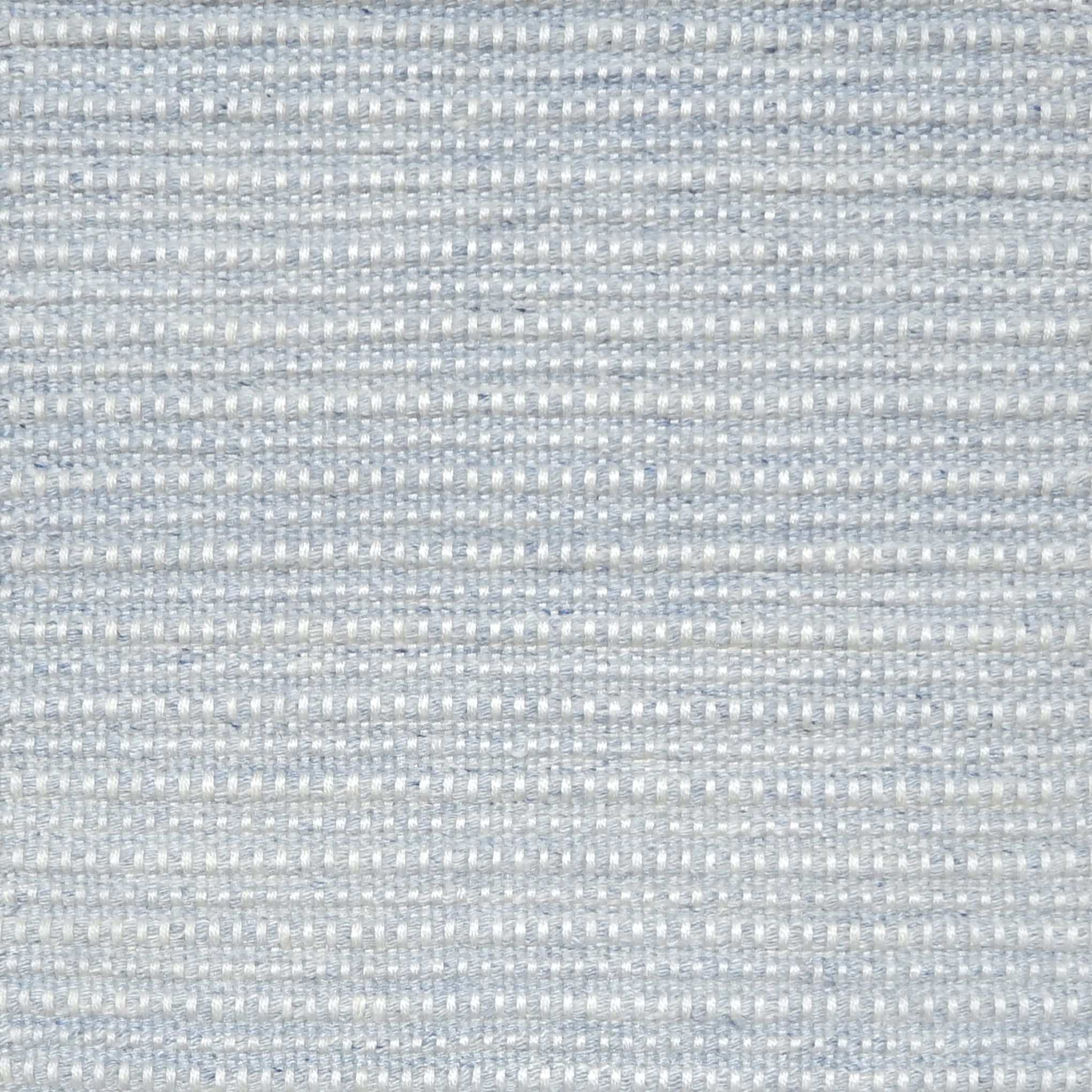 Close-up of cool grey textured woven rug