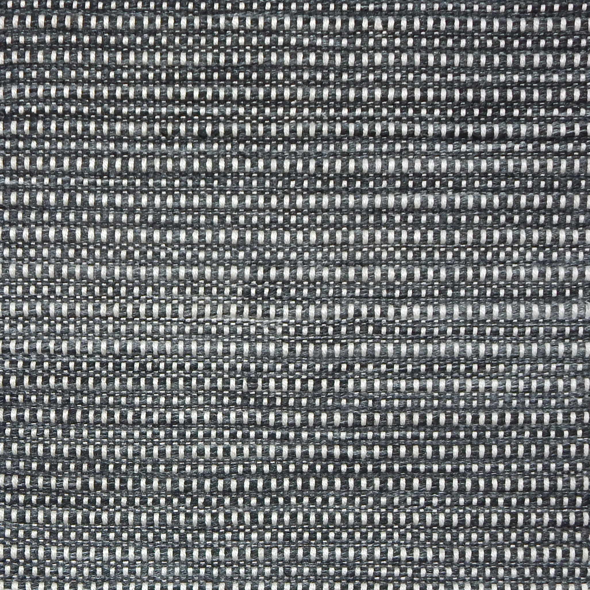 Textured black and white woven rug.