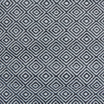 Patterned rug with black and white geometric design