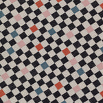 Detail of jacquard fabric in a checked pattern in shades of pink, red, blue and black on a tan field.