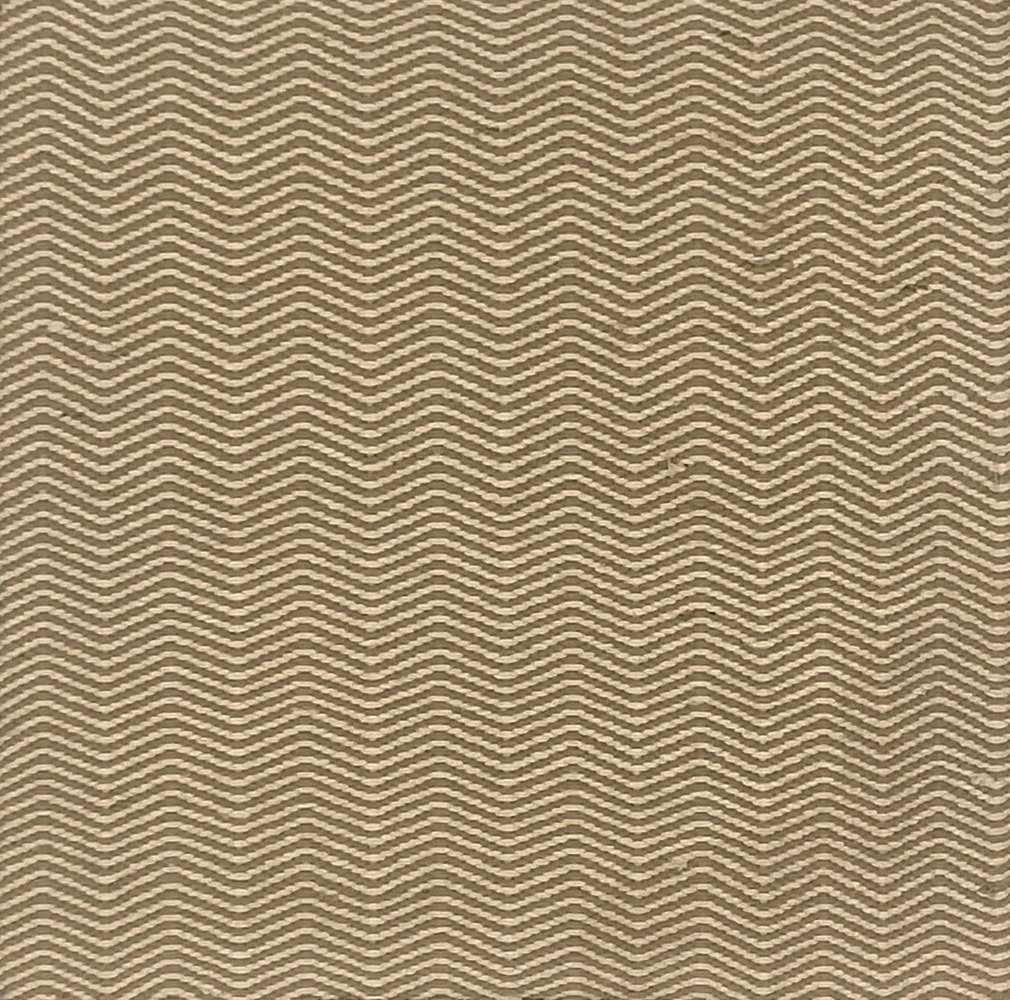 Flatweave carpet in herringbone pattern in cream and brown.