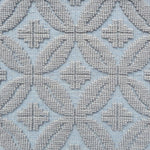 Handmade rug with classic circle lattice design in grey on a blue field. 